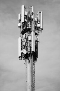 High-angle view of a telecommunication tower against the sky, showcasing modern infrastructure.